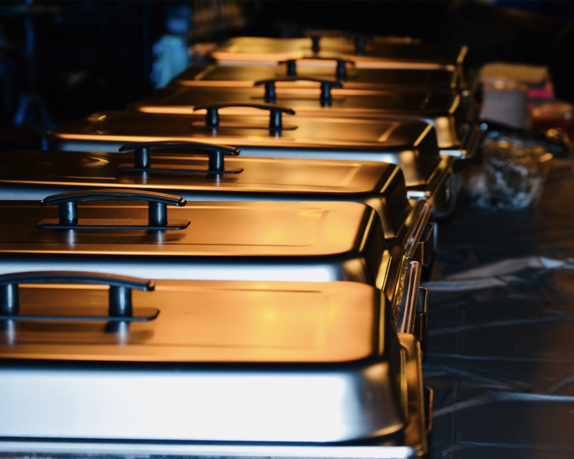 a row of catering warmers